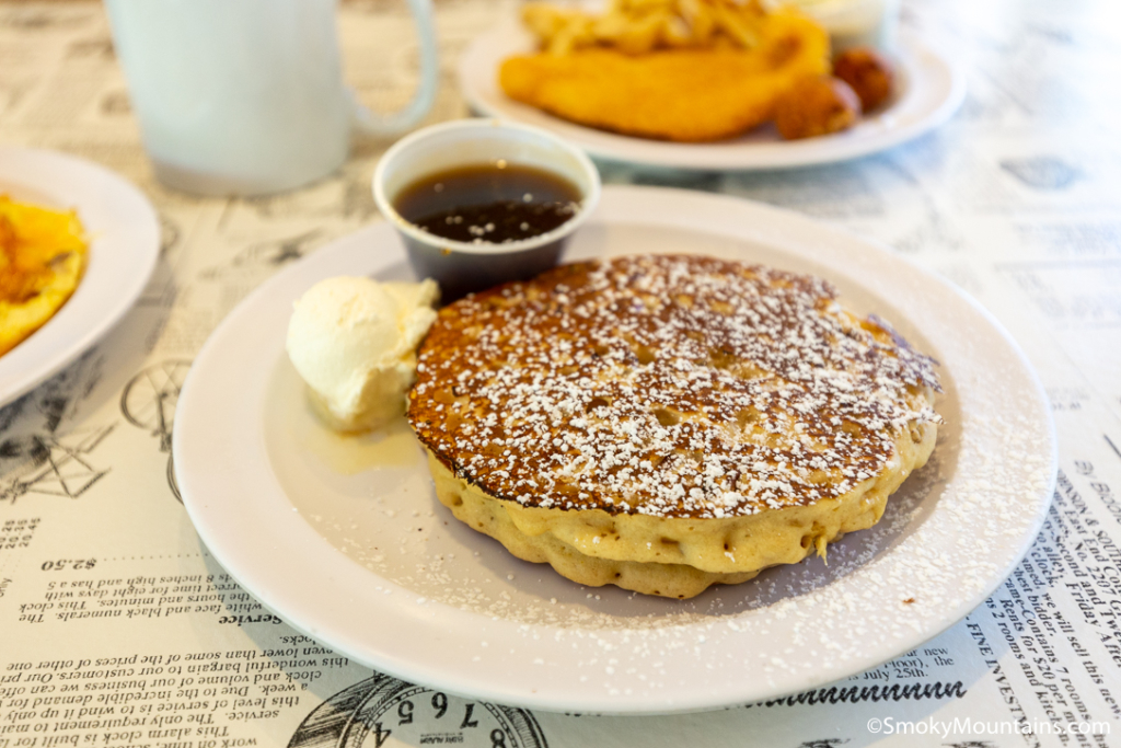 plate with a stack of pancakes and a side of syrup, little house of pancakes in gatlinburg tn