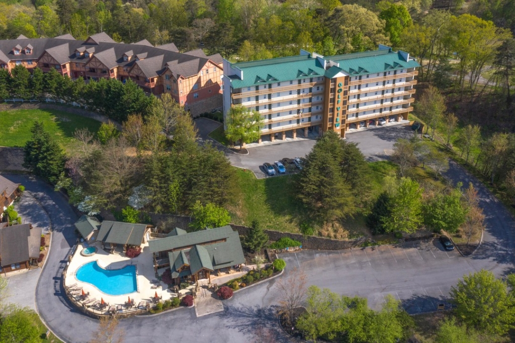 a green and tan resort-type building at a condo in the smoky mountains