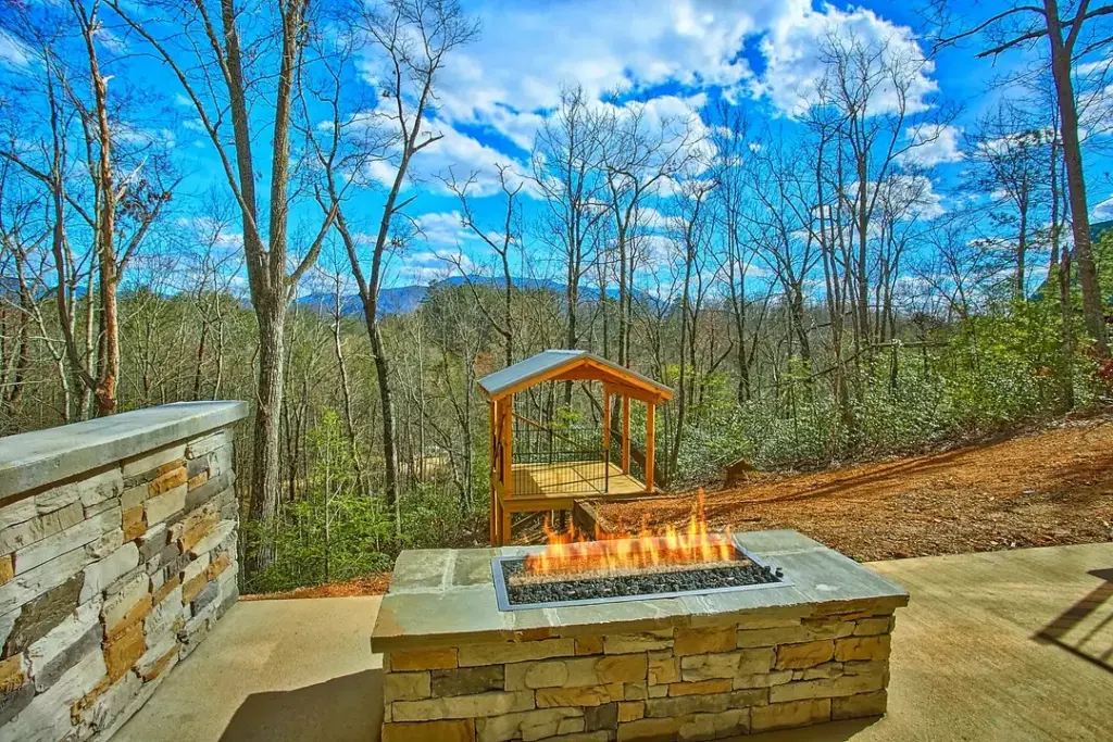 outdoor firepit overlooking the trees and mountains